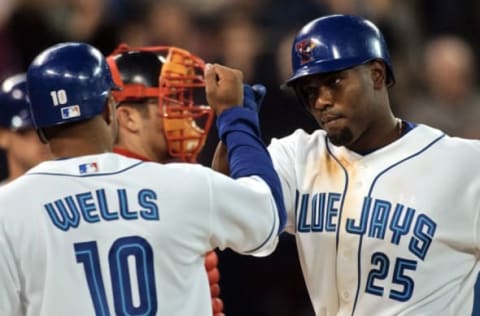 DIGITAL IMAGE – 04/08/03 – TORONTO, ONTARIO – Carlos Delgado is congradulated by Vernon Wells after hitting a two run homer during Toronto Blue Jays and Boston Red Sox Major Leage baseball action tonight at Skydome (LUCAS OLENIUK/TORONTO STAR) (Photo by Lucas Oleniuk/Toronto Star via Getty Images)