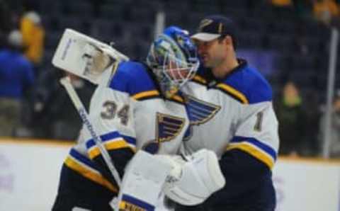 Nov 7, 2015; Nashville, TN, USA; St. Louis Blues goalie Jake Allen (34) is congratulated by goalie Brian Elliott (1) after a shutout win against the Nashville Predators at Bridgestone Arena. The Blues won 4-0. Mandatory Credit: Christopher Hanewinckel-USA TODAY Sports