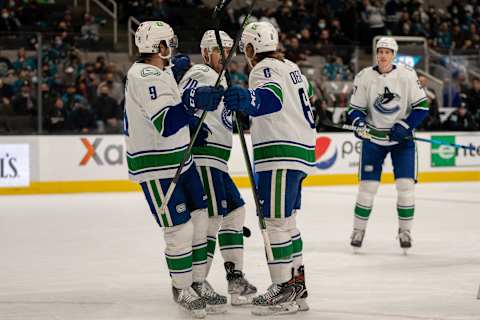 Dec 16, 2021; San Jose, California, USA; Vancouver Canucks right wing Brock Boeser (6), left wing Tanner Pearson (70) and center J.T. Miller (9) celebrate after the goal during the first period against the San Jose Sharks at SAP Center at San Jose. Mandatory Credit: Neville E. Guard-USA TODAY Sports