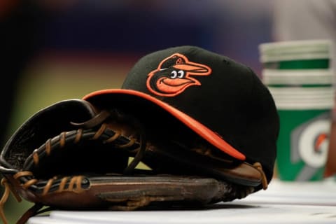 Apr 6, 2015; St. Petersburg, FL, USA; A general view of Baltimore Orioles glove and hat lays in the dugout against the Tampa Bay Rays at Tropicana Field. Mandatory Credit: Kim Klement-USA TODAY Sports