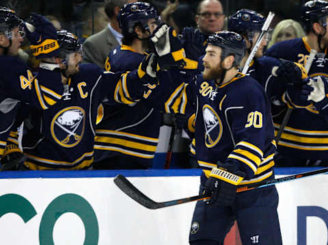 Dec 31, 2015; Buffalo, NY, USA; Buffalo Sabres center Ryan O’Reilly (90) celebrates his goal during the third period against the New York Islanders at First Niagara Center. Islanders beat the Sabres 2-1. Mandatory Credit: Timothy T. Ludwig-USA TODAY Sports