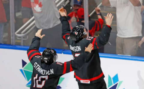 Aug 20, 2022; Edmonton, Alberta, CAN; Team Canada forward Kent Johnson (13) celebrates his winning goal in overtime against Team Finland in the championship game during the IIHF U20 Ice Hockey World Championship at Rogers Place. Mandatory Credit: Perry Nelson-USA TODAY Sports