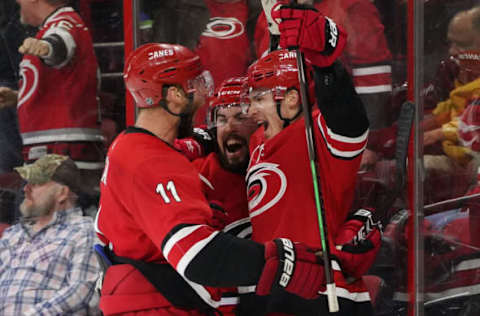 RALEIGH, NC – MARCH 24: Carolina Hurricanes Left Wing Andrei Svechnikov (37) celebrates after scoring the game winning goal in overtime with Carolina Hurricanes Defenceman Justin Faulk (27) and Carolina Hurricanes Center Jordan Staal (11) during a game between the Montreal Canadiens at the Carolina Hurricanes at the PNC Arena in Raleigh, NC on March 24, 2019. (Photo by Greg Thompson/Icon Sportswire via Getty Images)