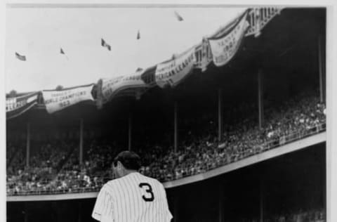 Babe Ruth, wearing his Yankees uniform for the last time, acknowledges the crowd at Yankee Stadium in the Bronx at a June 1948 ceremony in which his former team officially retired his jersey number. Ruth, ill with cancer, died two months later. (Photo by Library of Congress/Corbis/VCG via Getty Images)