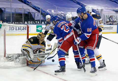 Tuukka Rask #40 of the Boston Bruins makes the save on Chris Kreider #20 of the New York Rangers . (Photo by Bruce Bennett/Getty Images)