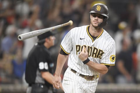 SAN DIEGO, CA – SEPTEMBER 4: Wil Myers #5 of the San Diego Padres flips his bat after hitting a two-run home run during the seventh inning of a baseball game against the Houston Astros at Petco Park on September 4, 2021 in San Diego, California. (Photo by Denis Poroy/Getty Images)