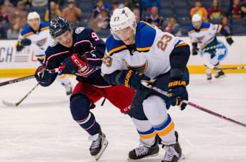 COLUMBUS, OH – SEPTEMBER 23: Columbus Blue Jackets left wing Artemi Panarin (9) and St. Louis Blues right wing Dmitrij Jaskin (23) battle for the puck in the third period of a game between the Columbus Blue Jackets and the St. Louis Blues on September 23, 2018 at Nationwide Arena in Columbus, OH. The Blues won 5-1. (Photo by Adam Lacy/Icon Sportswire via Getty Images)