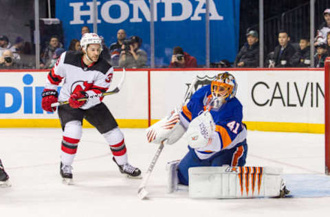 BROOKLYN, NY – JANUARY 07: New York Islanders Goalie Jaroslav Halak (41) gloves a shot by New Jersey Devils Winger Brian Gibbons (39) during the first period of a Metropolitan Division match-up between the New Jersey Devils and the New York Islanders on January 07, 2018, at Barclays Center in Brooklyn, NY. (Photo by David Hahn/Icon Sportswire via Getty Images)