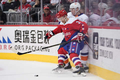 WASHINGTON, DC – APRIL 06: Nick Jensen #3 of the Washington Capitals and Casey Cizikas #53 of the New York Islanders battle for the puck in the second period at Capital One Arena on April 6, 2019 in Washington, DC. (Photo by Patrick McDermott/NHLI via Getty Images)