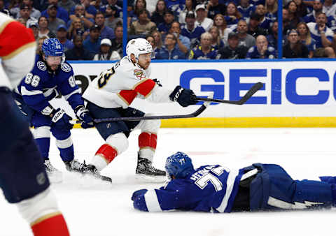 May 23, 2022; Tampa, Florida, USA; Tampa Bay Lightning right wing Nikita Kucherov (86) and Tampa Bay Lightning defenseman Victor Hedman (77) defend Florida Panthers center Sam Reinhart (13) during the second period at Amalie Arena. Mandatory Credit: Kim Klement-USA TODAY Sports