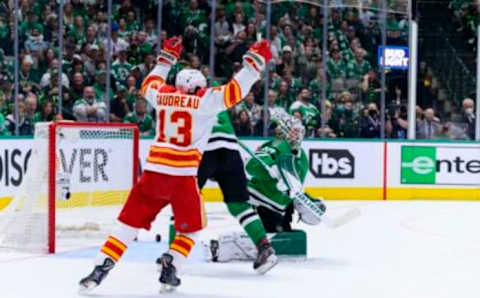 May 9, 2022; Dallas, Texas, USA; Calgary Flames left wing Johnny Gaudreau (13) celebrates a power play goal scored by defenseman Rasmus Andersson (not pictured) against Dallas Stars goaltender Jake Oettinger (29) during the second period in game four of the first round of the 2022 Stanley Cup Playoffs at American Airlines Center. Mandatory Credit: Jerome Miron-USA TODAY Sports