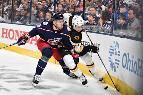 COLUMBUS, OH – MAY 2: Pierre-Luc Dubois #18 of the Columbus Blue Jackets attempts to knock Charlie McAvoy #73 of the Boston Bruins off the puck during the first period in Game Four of the Eastern Conference Second Round during the 2019 NHL Stanley Cup Playoffs on May 2, 2019 at Nationwide Arena in Columbus, Ohio. (Photo by Jamie Sabau/NHLI via Getty Images)