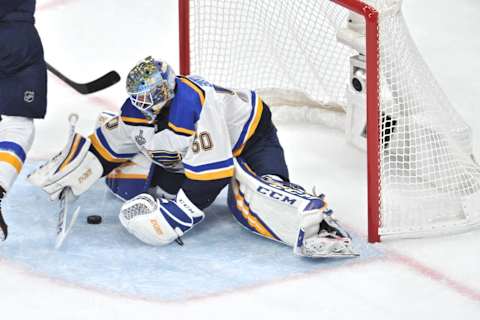 BOSTON, MA – JUNE 12: St. Louis Blues goaltender Jordan Binnington (50) makes a nice stop and covers up the puck. During Game 7 of the Stanley Cup Finals featuring the St. Louis Blues against the Boston Bruins on June 12, 2019 at TD Garden in Boston, MA. (Photo by Michael Tureski/Icon Sportswire via Getty Images)