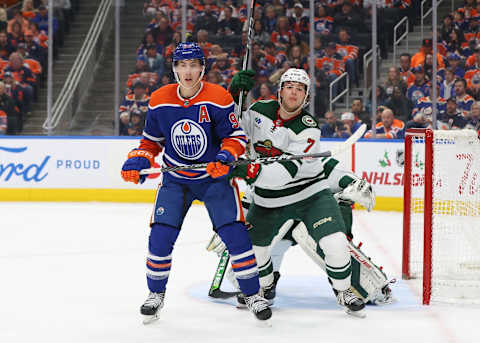 EDMONTON, CANADA – DECEMBER 8: Ryan Nugent-Hopkins #93 of the Edmonton Oilers battles with Brock Faber #7 of the Minnesota Wild in the third period on December 8, 2023 at Rogers Place in Edmonton, Alberta, Canada. (Photo by Lawrence Scott/Getty Images)