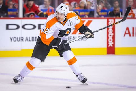 Nov 5, 2015; Calgary, Alberta, CAN; Philadelphia Flyers defenseman Mark Streit (32) shoot the puck against the Calgary Flames during the first period at Scotiabank Saddledome. Calgary Flames won 2-1. Mandatory Credit: Sergei Belski-USA TODAY Sports