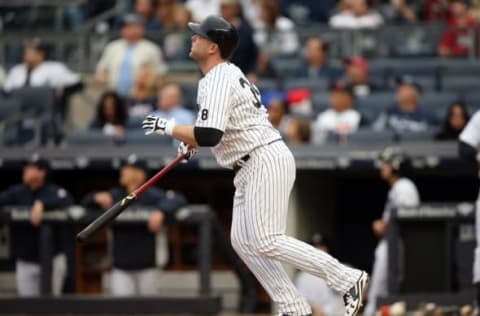 Oct 2, 2016; Bronx, NY, USA; New York Yankees catcher Brian McCann (34) hits a home run in the bottom of the fourth inning against the Baltimore Orioles at Yankee Stadium. It was the 20th home run of the season for McCann. Mandatory Credit: Danny Wild-USA TODAY Sports