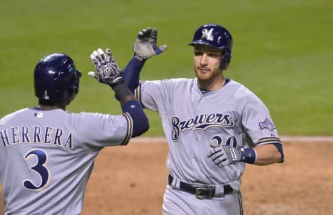 Aug 25, 2015; Cleveland, OH, USA; Milwaukee Brewers catcher Jonathan Lucroy (20) celebrates his two-run home run with second baseman Elian Herrera (3) in the eighth inning against the Cleveland Indians at Progressive Field. Mandatory Credit: David Richard-USA TODAY Sports