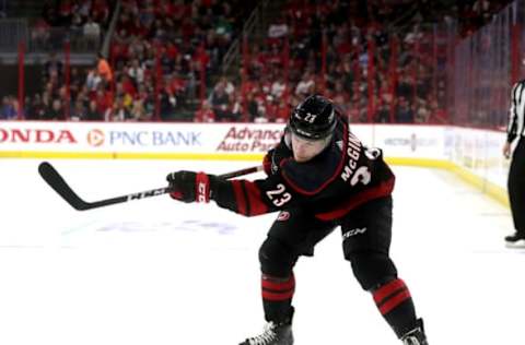 RALEIGH, NC – APRIL 15: Brock McGinn #23 of the Carolina Hurricanes shoots the puck in Game Three of the Eastern Conference First Round against the Washington Capitals during the 2019 NHL Stanley Cup Playoffs on April 15, 2019 at PNC Arena in Raleigh, North Carolina. (Photo by Gregg Forwerck/NHLI via Getty Images)