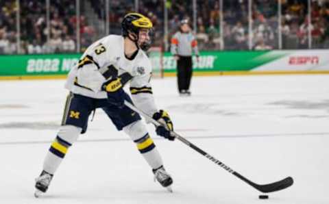 Michigan forward Kent Johnson looks to pass against Denver during the first period of the Frozen Four semifinal at the TD Garden in Boston, Mass. on Thursday, April 7, 2022.