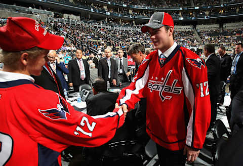 PITTSBURGH, PA – JUNE 22: Thomas Wilson, 16th overall pick by the Washington Capitals, shakes hands with Graham McPhee during Round One of the 2012 NHL Entry Draft at Consol Energy Center on June 22, 2012 in Pittsburgh, Pennsylvania. (Photo by Dave Sandford/NHLI via Getty Images)