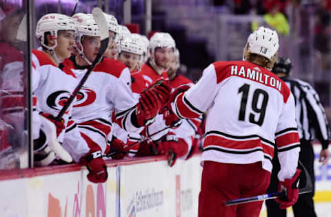 WASHINGTON, DC – MARCH 26: Dougie Hamilton #19 of the Carolina Hurricanes celebrates with his teammates after scoring a goal in the second period against the Washington Capitals at Capital One Arena on March 26, 2019 in Washington, DC. (Photo by Patrick McDermott/NHLI via Getty Images)