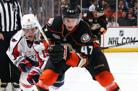 ANAHEIM, CA – MARCH 18: Hampus Lindholm #47 of the Anaheim Ducks battles for the puck against Nicklas Backstrom #19 of the Washington Capitals on March 18, 2014, at Honda Center in Anaheim, California. (Photo by Debora Robinson/NHLI via Getty Images)