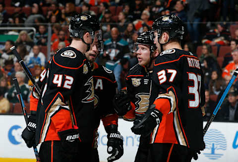 ANAHEIM, CA – JANUARY 11: Josh Manson #42, Adam Henrique #14, Ondrej Kase #25 and Nick Ritchie #37 of the Anaheim Ducks talk while waiting for play to resume during the second period of the game against the Pittsburgh Penguins at Honda Center on January 11, 2019, in Anaheim, California. (Photo by Debora Robinson/NHLI via Getty Images)