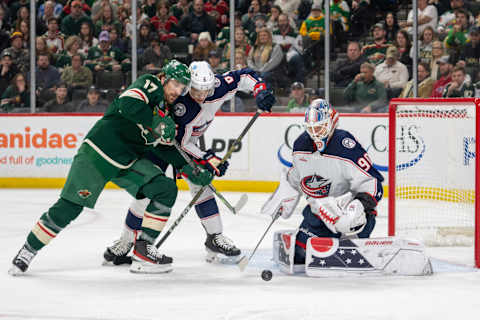 Feb 26, 2023; Saint Paul, Minnesota, USA; Minnesota Wild left wing Marcus Foligno (17) and Columbus Blue Jackets defenseman Billy Sweezey (6) battle for the puck in front of goaltender Elvis Merzlikins (90) in the second period at Xcel Energy Center. Mandatory Credit: Matt Blewett-USA TODAY Sports