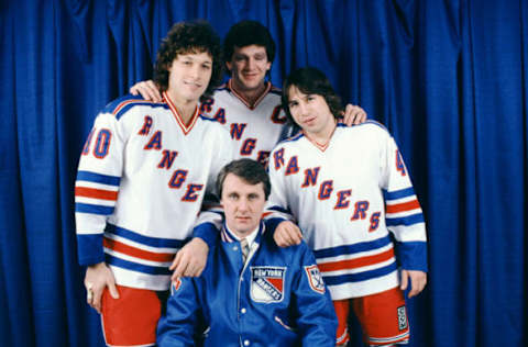 NEW YORK, NY – DECEMBER, 1981: Ron Duguay #10, Barry Beck #3, Mark Pavelich #40 and head coach Herb Brooks pose for a portrait before an NHL game circa December, 1981 at the Madison Square Garden in New York, New York. (Photo by Bruce Bennett Studios/Getty Images)