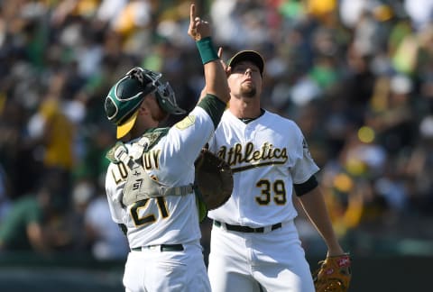 OAKLAND, CA – SEPTEMBER 03: Blake Treinen #39 and Jonathan Lucroy #21 of the Oakland Athletics celebrates defeating the New York Yankees 6-3 at Oakland Alameda Coliseum on September 3, 2018 in Oakland, California. (Photo by Thearon W. Henderson/Getty Images)