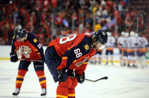 Apr 14, 2016; Sunrise, FL, USA; Florida Panthers right winger Jaromir Jagr (68) bows his head as the New York Islanders celebrate their 5-4 victory in game one of the first round of the 2016 Stanley Cup Playoffs at BB&T Center. Mandatory Credit: Robert Duyos-USA TODAY Sports