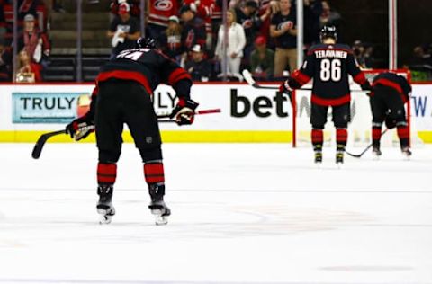 RALEIGH, NORTH CAROLINA – JUNE 08: Jaccob Slavin #74 of the Carolina Hurricanes and his teammates react following their loss to the Tampa Bay Lightning in Game Five of the Second Round of the 2021 Stanley Cup Playoffs at PNC Arena on June 08, 2021, in Raleigh, North Carolina. (Photo by Jared C. Tilton/Getty Images)