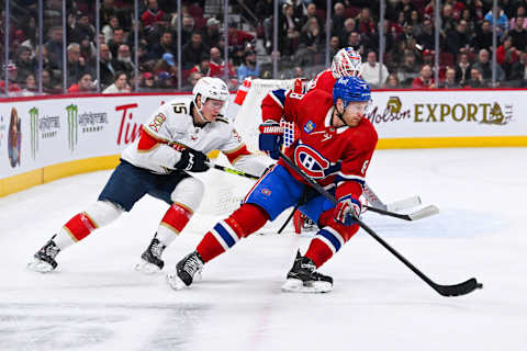 Mar 30, 2023; Montreal, Quebec, CAN; Montreal Canadiens defenseman Mike Matheson (8) defends the puck against Florida Panthers center Anton Lundell (15) during the first period at Bell Centre. Mandatory Credit: David Kirouac-USA TODAY Sports