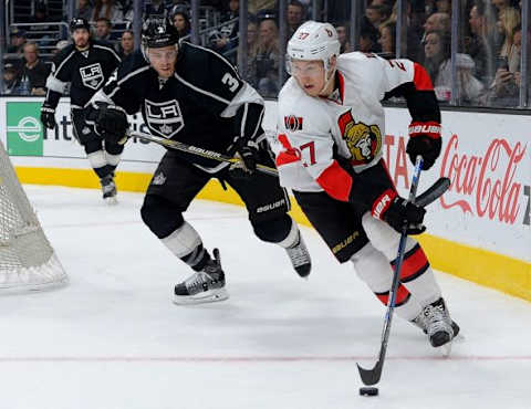 Jan 16, 2016; Los Angeles, CA, USA; Los Angeles Kings defenseman Brayden McNabb (3) and Ottawa Senators right wing Curtis Lazar (27) chase down the puck in the first period of the game against the at Staples Center. Mandatory Credit: Jayne Kamin-Oncea-USA TODAY Sports