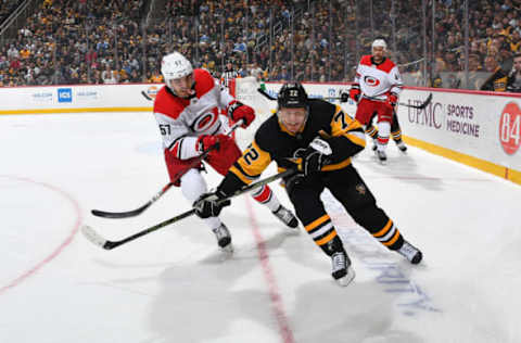 PITTSBURGH, PA – MARCH 31: Trevor van Riemsdyk #57 of the Carolina Hurricanes battles for position against Patric Hornqvist #72 of the Pittsburgh Penguins at PPG Paints Arena on March 31, 2019 in Pittsburgh, Pennsylvania. (Photo by Joe Sargent/NHLI via Getty Images)