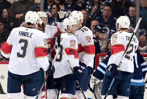 WINNIPEG, MB – FEBRUARY 18: Keith Yandle #3, Jonathan Huberdeau #11, Evgenii Dadonov #63, Aleksander Barkov #16 and Vincent Trocheck #21 of the Florida Panthers celebrate a second period goal against the Winnipeg Jets at the Bell MTS Place on February 18, 2018 in Winnipeg, Manitoba, Canada. (Photo by Jonathan Kozub/NHLI via Getty Images)