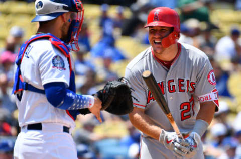 LOS ANGELES, CA – JULY 15: Los Angeles Angels center fielder Mike Trout (27) laughs with Los Angeles Dodgers catcher Yasmani Grandal (9) during a MLB game between the Los Angeles Angels of Anaheim and the Los Angeles Dodgers on July 15, 2018 at Dodger Stadium in Los Angeles, CA. (Photo by Brian Rothmuller/Icon Sportswire via Getty Images)