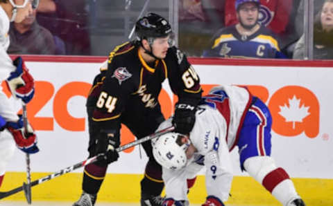 LAVAL, QC – OCTOBER 04: Trey Fix-Wolansky #64 of the Cleveland Monsters plays rough with Otto Leskinen #28 of the Laval Rocket in the third period at Place Bell on October 4, 2019 in Laval, Canada. (Photo by Minas Panagiotakis/Getty Images)