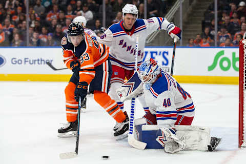 Ryan Nugent-Hopkins #93 of the Edmonton Oilers takes a shot on goaltender Alexandar Georgiev #40 of the New York Rangers (Photo by Codie McLachlan/Getty Images)