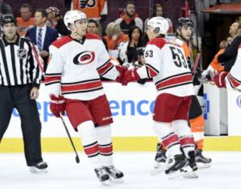 Dec 15, 2015; Philadelphia, PA, USA; Carolina Hurricanes left wing Jeff Skinner (53) celebrates his goal with center Victor Rask (49) against the Philadelphia Flyers during the first period at Wells Fargo Center. Mandatory Credit: Eric Hartline-USA TODAY Sports