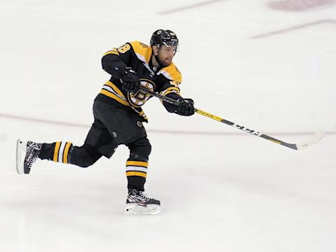 Aug 29, 2020; Toronto, Ontario, CAN; Boston Bruins defenseman Matt Grzelcyk (48) shoots the puck against the Tampa Bay Lightning in game four of the second round of the 2020 Stanley Cup Playoffs at Scotiabank Arena. Mandatory Credit: John E. Sokolowski-USA TODAY Sports