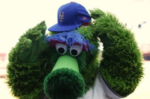 PHILADELPHIA, PA – OCTOBER 01: The Phillie Phanatic puts on the Mets cap of Jeurys Familia