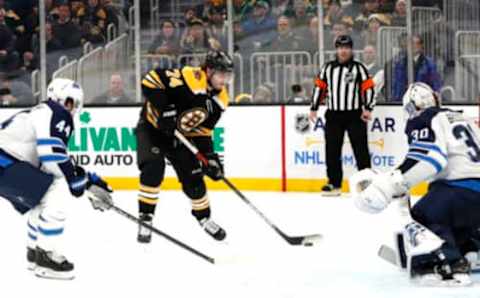 BOSTON, MA – JANUARY 09: Boston Bruins left wing Jake DeBrusk (74) shoots on Winnipeg Jets goalie Laurent Brossoit (30) during a game between the Boston Bruins and the Winnipeg Jets on January 9, 2020, at TD Garden in Boston, Massachusetts. (Photo by Fred Kfoury III/Icon Sportswire via Getty Images)