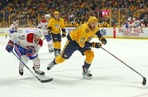 NASHVILLE, TN – NOVEMBER 22: Mattias Ekholm #14 of the Nashville Predators and Paul Byron #41 of the Montreal Canadiens chase a loose puck during the second period at Bridgestone Arena on November 22, 2017 in Nashville, Tennessee. (Photo by Frederick Breedon/Getty Images)