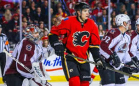 Mar 18, 2016; Calgary, Alberta, CAN; Calgary Flames center Joe Colborne (8) screens in front of Colorado Avalanche goalie Semyon Varlamov (1) during the second period at Scotiabank Saddledome. Colorado Avalanche won 4-3. Mandatory Credit: Sergei Belski-USA TODAY Sports