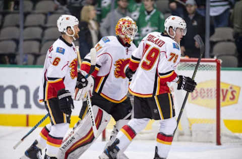 NHL Power Rankings: Calgary Flames defenseman Dennis Wideman (6) and goalie Chad Johnson (31) and left wing Micheal Ferland (79) skate off the ice after the win over the Dallas Stars at the American Airlines Center. The Flames defeat the Stars 2-1. Mandatory Credit: Jerome Miron-USA TODAY Sports