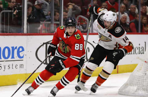 CHICAGO, IL – OCTOBER 23: Patrick Kane #88 of the Chicago Blackhawks turns with the puck in front of Adam Henrique #14 of the Anaheim Ducks at the United Center on October 23, 2018, in Chicago, Illinois. The Blackhawks defeated the Ducks 3-1. (Photo by Jonathan Daniel/Getty Images)