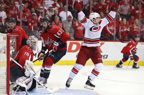 WASHINGTON, DC – APRIL 24: Brock McGinn #23 of the Carolina Hurricanes celebrates his game-winning goal with teammates against the Washington Capitals at 11:05 of the second overime period in Game Seven of the Eastern Conference First Round during the 2019 NHL Stanley Cup Playoffs at the Capital One Arena on April 24, 2019 in Washington, DC. The Hurricanes defeated the Capitals 4-3 in the second overtime period to move on to Round Two of the Stanley Cup playoffs. (Photo by Patrick Smith/Getty Images)