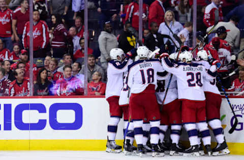 WASHINGTON, DC – APRIL 12: Artemi Panarin #9 of the Columbus Blue Jackets celebrates with his teammates after scoring the game-winning goal in overtime against the Washington Capitals in Game One of the Eastern Conference First Round during the 2018 NHL Stanley Cup Playoffs at Capital One Arena on April 12, 2018 in Washington, DC. (Photo by Patrick McDermott/NHLI via Getty Images)