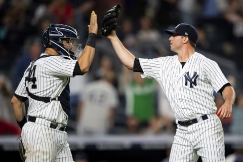 NEW YORK, NY – SEPTEMBER 18: Zach Britton #53 of the New York Yankees high fives Gary Sanchez #24 after recording the final out during the ninth inning of a game against the Boston Red Sox on September 18, 2018 at Yankee Stadium in the Bronx borough of New York City. (Photo by Billie Weiss/Boston Red Sox/Getty Images)